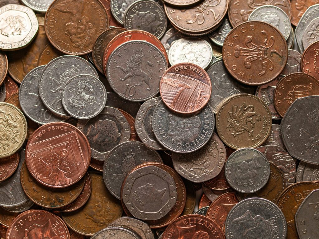 Look after the pennies and the pounds look after themselves. A pile of coins to represent letting agent fees.